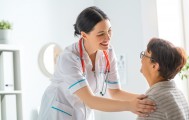 Female patient listening to doctor in medical office.